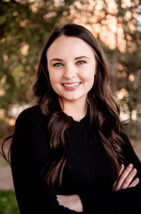 Jenny Cohen standing in blue blouse